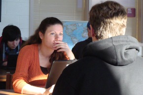 Cathy conferences with a student